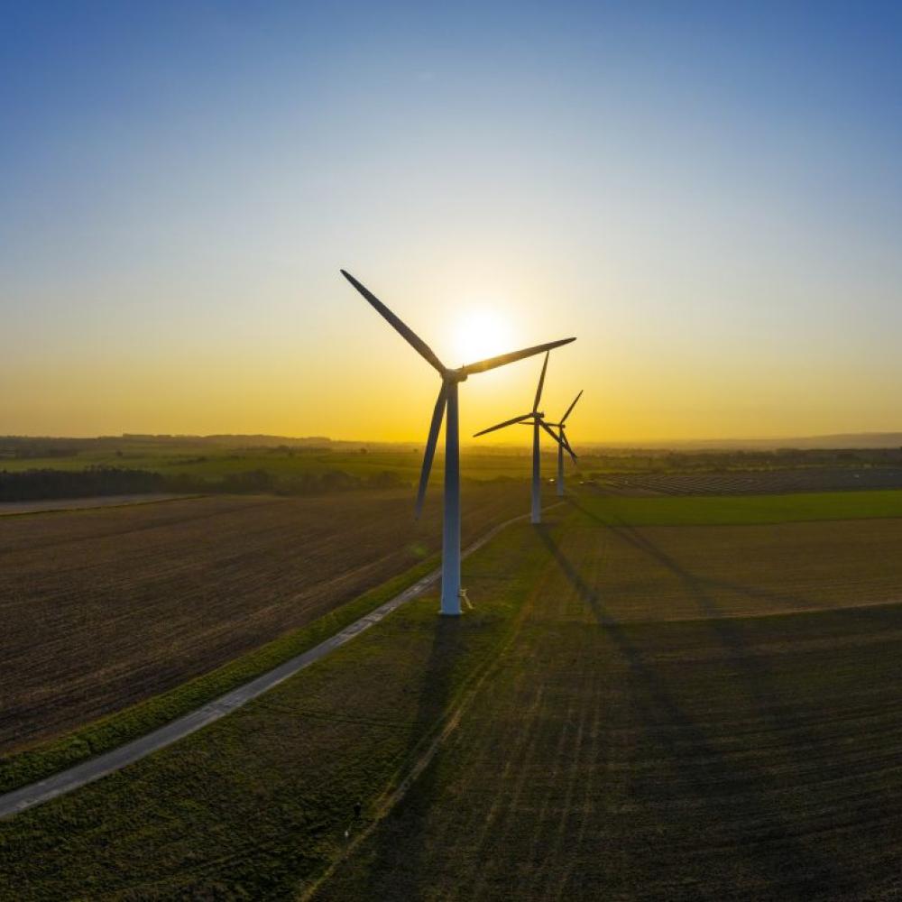 Windmill in field for renewable energy 